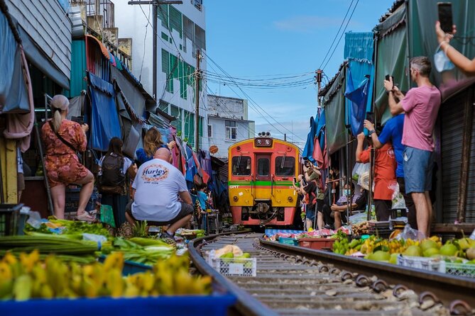 Amphawa Floating Market & Maeklong Railway Train Market Tour - Maeklong Railway Train Market: When the rails cut right through