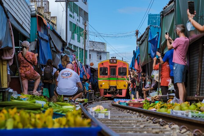 Damnoen Saduak Floating Market & Ayutthaya Tour from Bangkok - Mae Klong Railway Market: Seeing the Train Up Close (Without the Chaos)