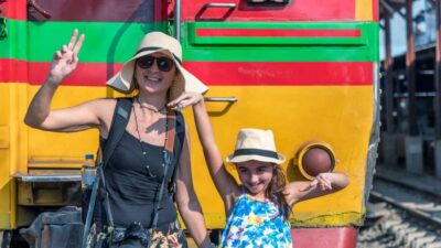 Private Tour from Bangkok: Railway & Floating Markets - Maeklong Railway Market: watching a train pass through the stalls